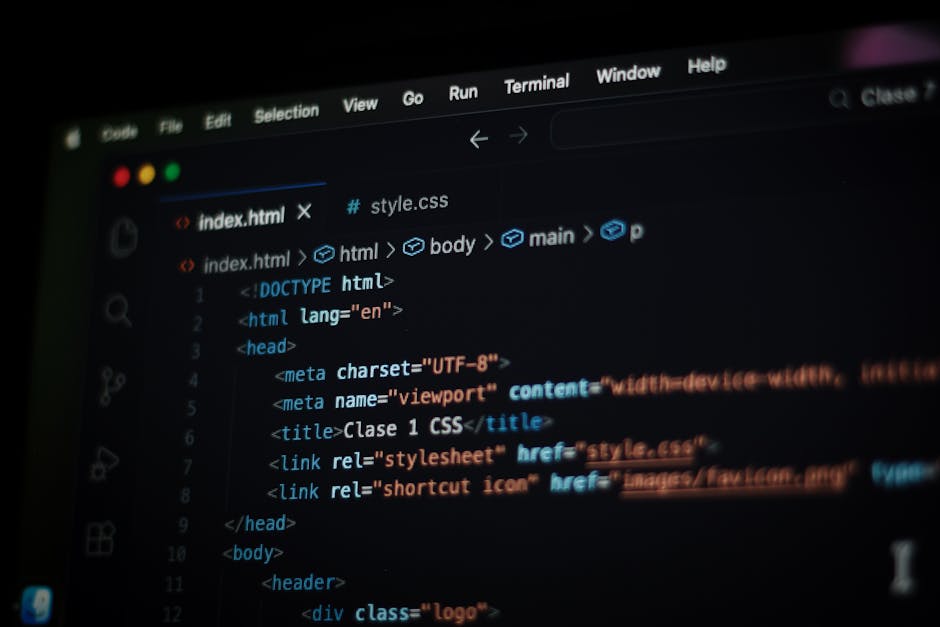 A close-up view of a computer screen displaying lines of code in a dark environment, with text in various colors including green, white, and orange. The code appears to be related to programming or sc